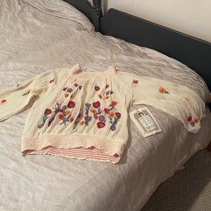 Women’s blouse  off the shoulder, floral Mexican heritage style.